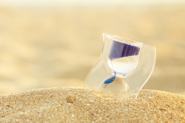 Hourglass Clock on the Sand Beach