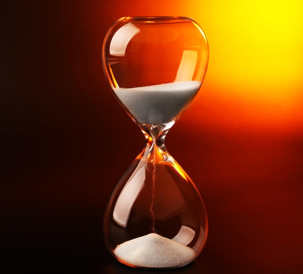 hourglass on dark color background