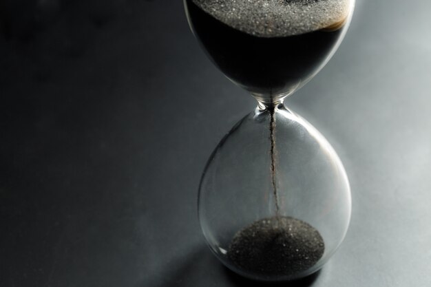 Hourglass on dark surface