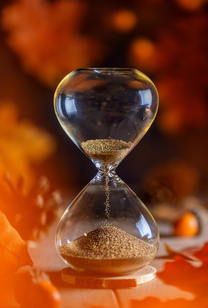 Hourglass leaves concept of time the onset of autumn