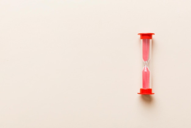 hourglass on the table sand clock as time passing concept for business deadline copy space