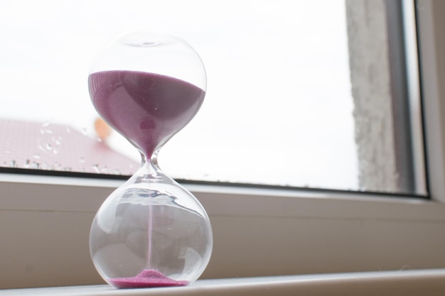 Hourglass with pink sand