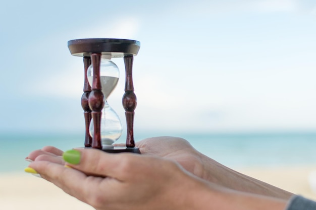 Hourglass in women's hands