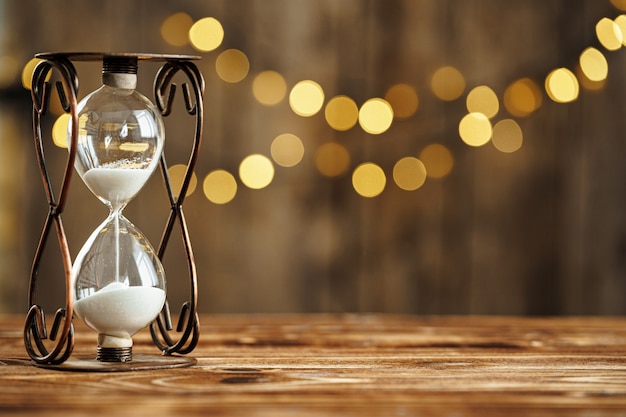 Hourglass on wooden desk