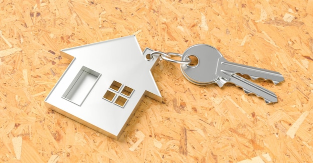 House as a pendant on a key on plywood floor as a house purchase and housing concept