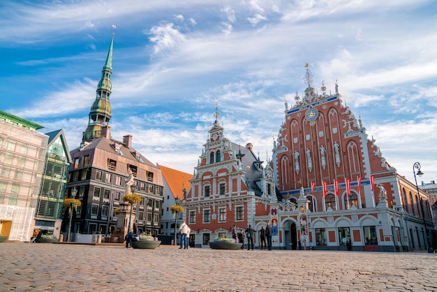 House of the Blackheads and Saint Peters church in Riga in a beautiful summer evening in Latvia. Aerial view from above.