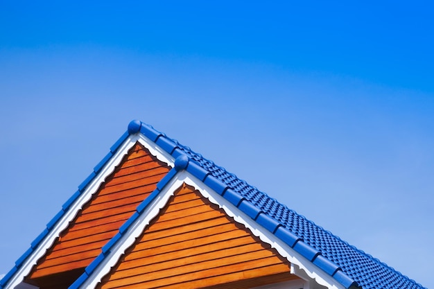 House blue roof on blue sky backgroundgeneric view to facade of a new modern building with blue skyasia house style