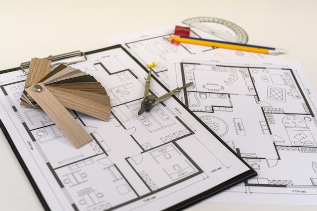 house blueprint with wooden vinyl sampler on desk industry