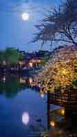 Photo a house by the lake with a tree in the foreground