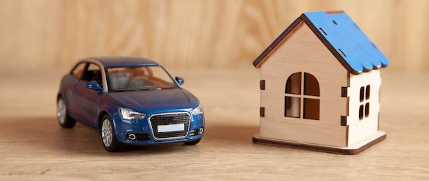 House and car on a wooden table