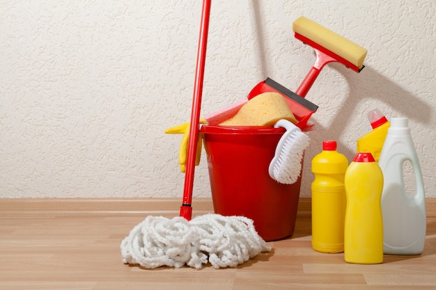 House Cleaning Equipment and Supplies in Bucket on the Floor