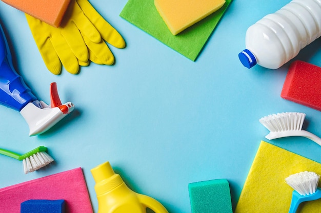 Photo house cleaning product on blue background copy space