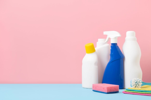 House cleaning product on blue pink bg copy space