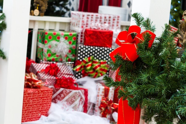 House decorated with evergreens for Christmas.