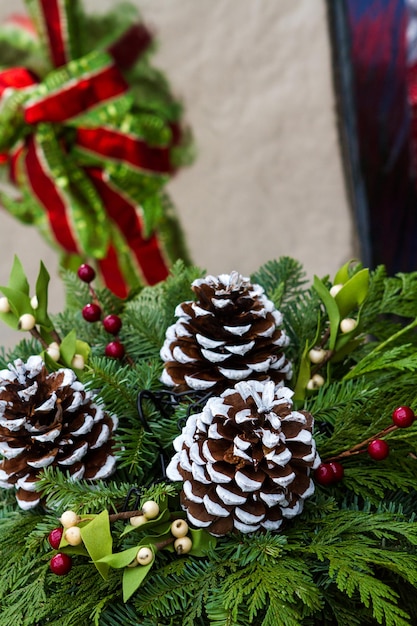 House decorated with evergreens for Christmas.