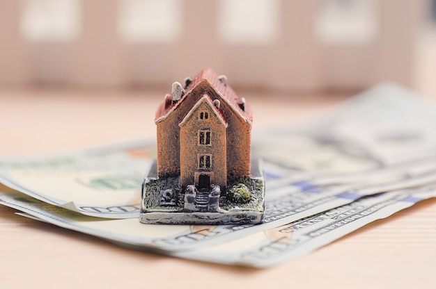 Photo house on denominations of money, the concept of buying a property