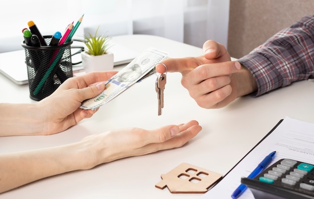 House developers and customer shaking hand after finish buying or rental real estate for transfer right of property