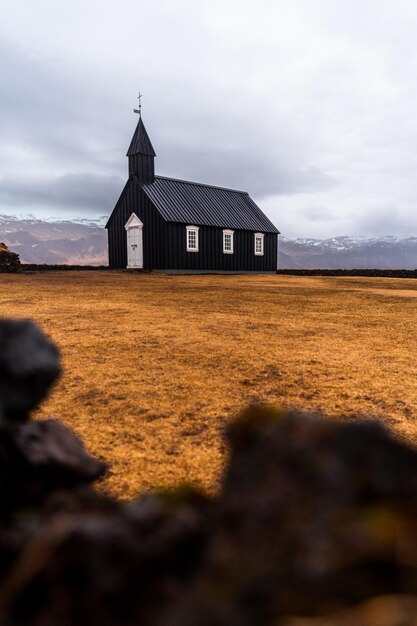 house on field against sky