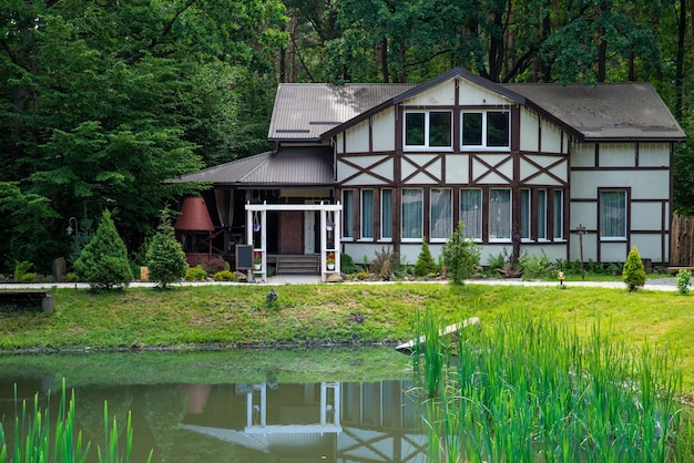 House in forest near lake scenic view