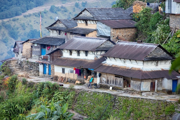 A house on a hill with a blue door