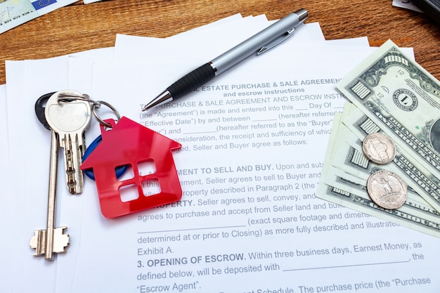 House, home, property, real estate purchase buying sale contract agreement pen money coins keys wooden background, expenses, buying, investment, finance, savings, concept close up selective focus