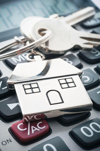 House key and calculator mortgage