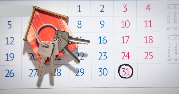 House keys on calendar background