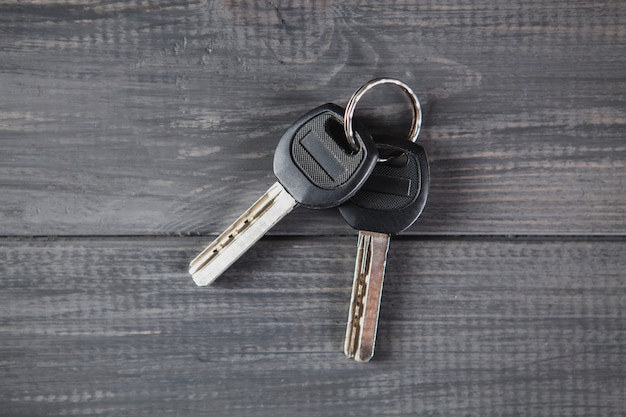 House keys on gray wooden table