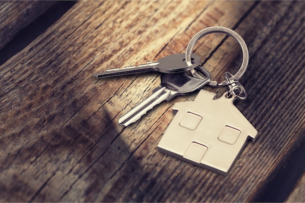 House keys with house figure  on background