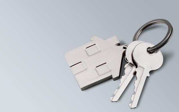 House keys with house figure  on background