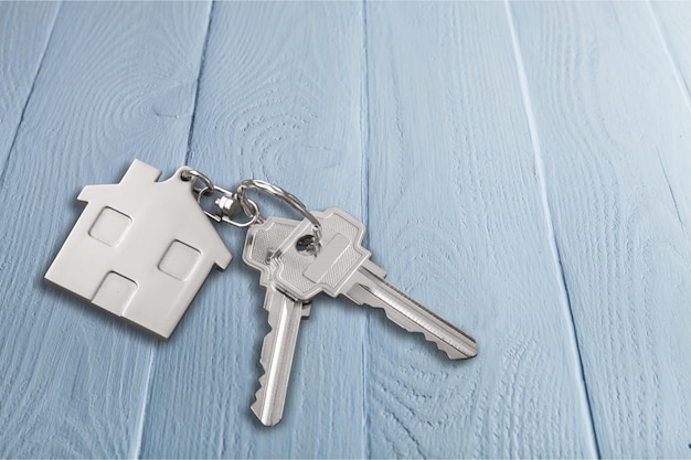 House keys with house figure  on background