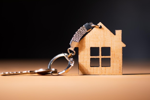 House keys and wooden house