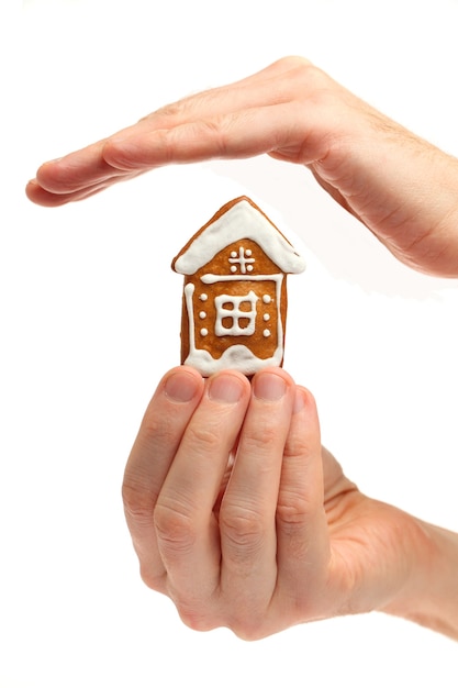 House in male hand isolated on white