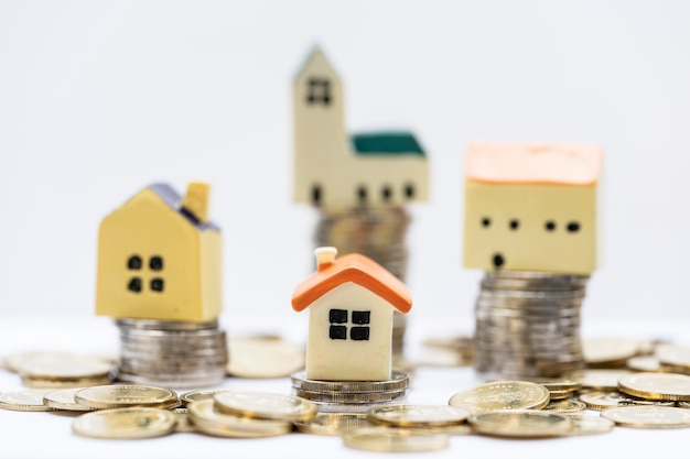 Photo house model on coins stack