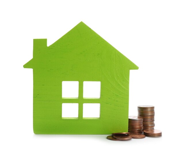 House model and coins on white background Money saving concept