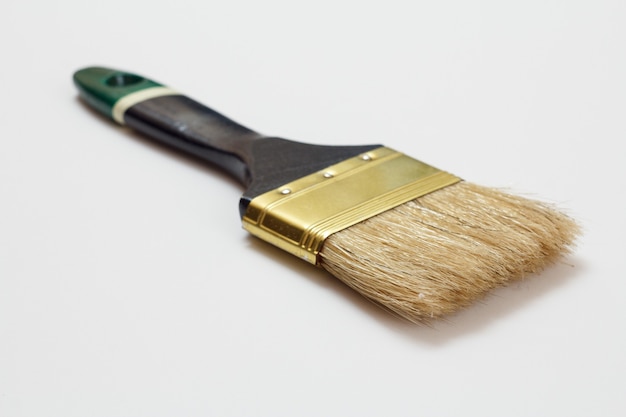 House painter brush on a white background. Repair tool. Building tool. Close-up view.