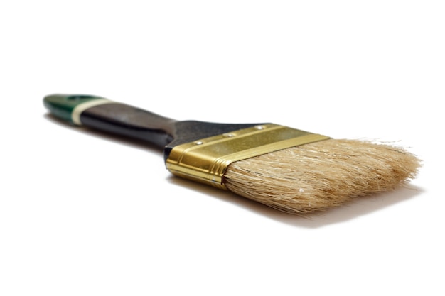 House painter brush on a white isolated background. Repair tool. Building tool. Close-up view.