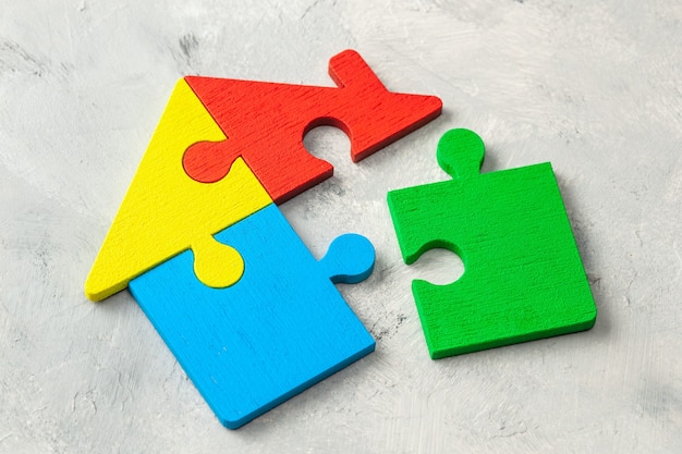 House puzzle Home loan. Parts of the house are brought together.