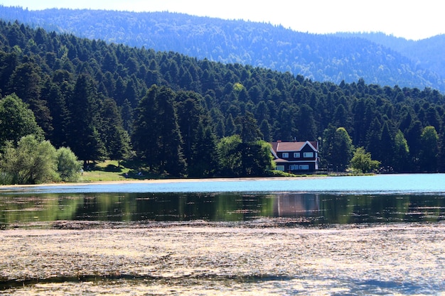 House on the shore of Cennet Gol Paradise Lake Bolu Reflected on water