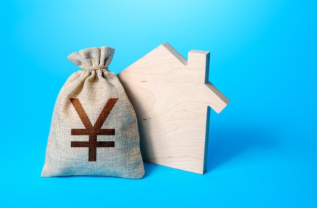 House silhouette and a chinese yuan or japanese yen symbol money bag Purchase investment in real estate construction Mortgage Realtor services House project Rental business Property appraisal