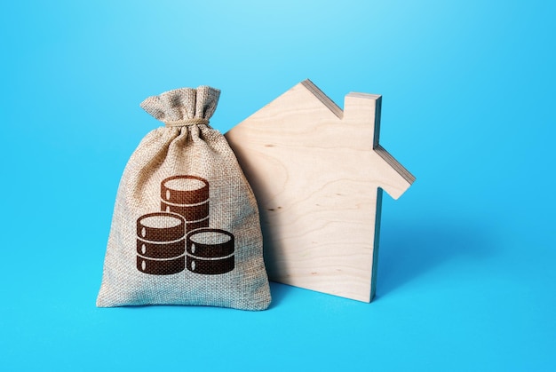House silhouette and a coin symbol money bag Home purchase investment in real estate construction