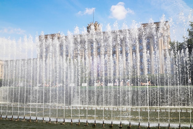 House of soviets behind jets of fountain summer sunny day saint petersburg russia june 2021