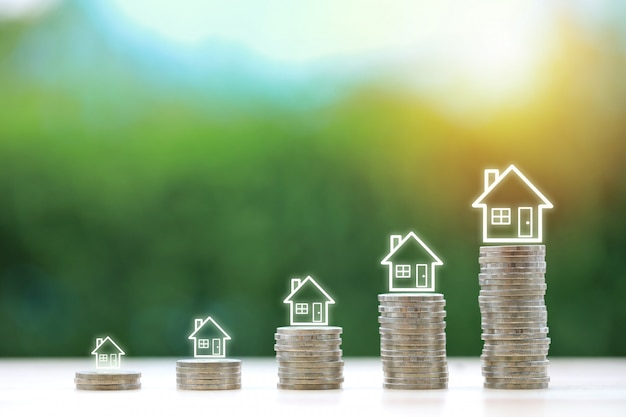 House on stacking coin on wooden desk