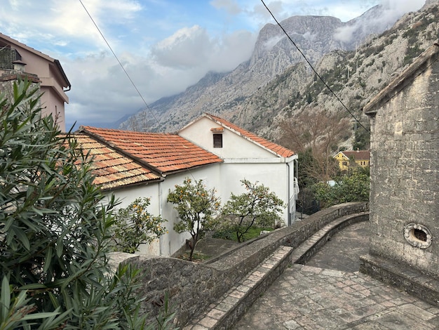 House stones Bay waves mountains Montenegro Kotor city