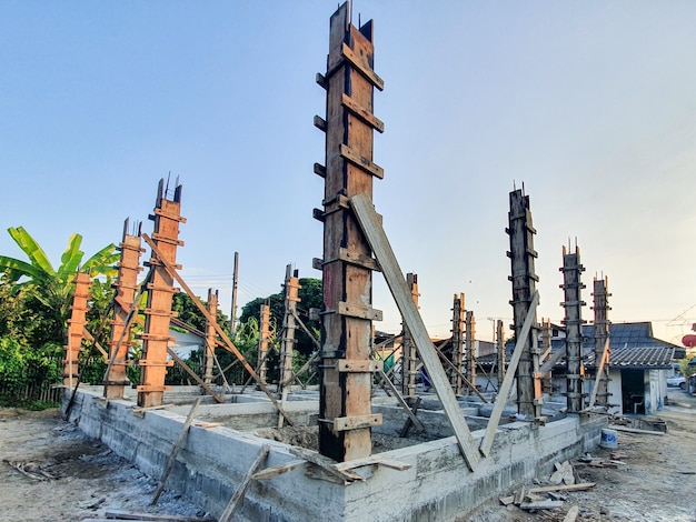 House structure construction Pour the cement floor and pour the cement pillars already. Background its sky.