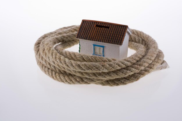 house surrounded by rope on a white background