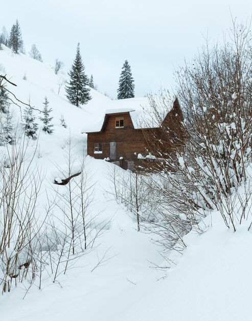 House on winter slope