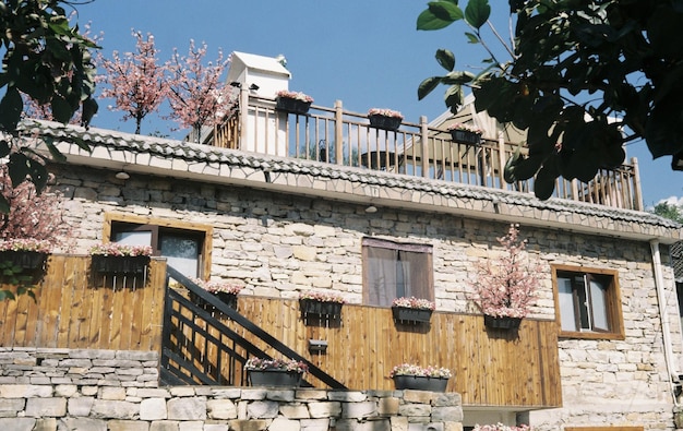 A house with a balcony and wooden railings