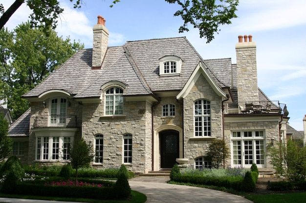 a house with a chimney and a brick chimney on the roof