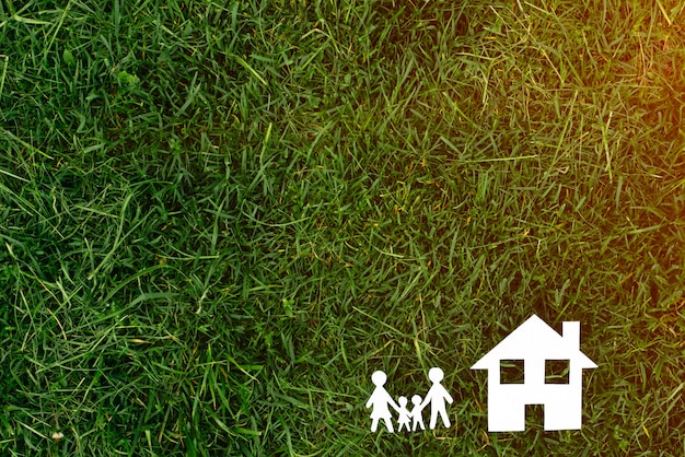 House with family on grass background